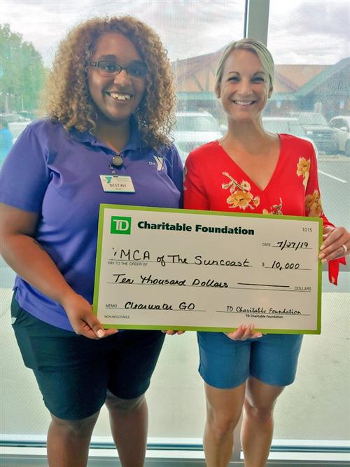 Ms. Destiny & Ms. Defant receiving $10,000 check 